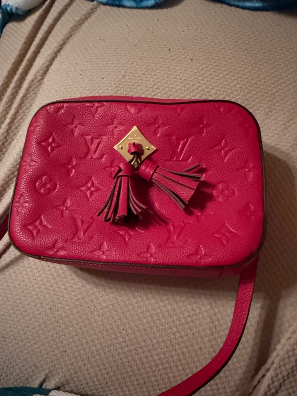 Louis Vuitton red Monogram Embossed Leather Crossbody with Tassel